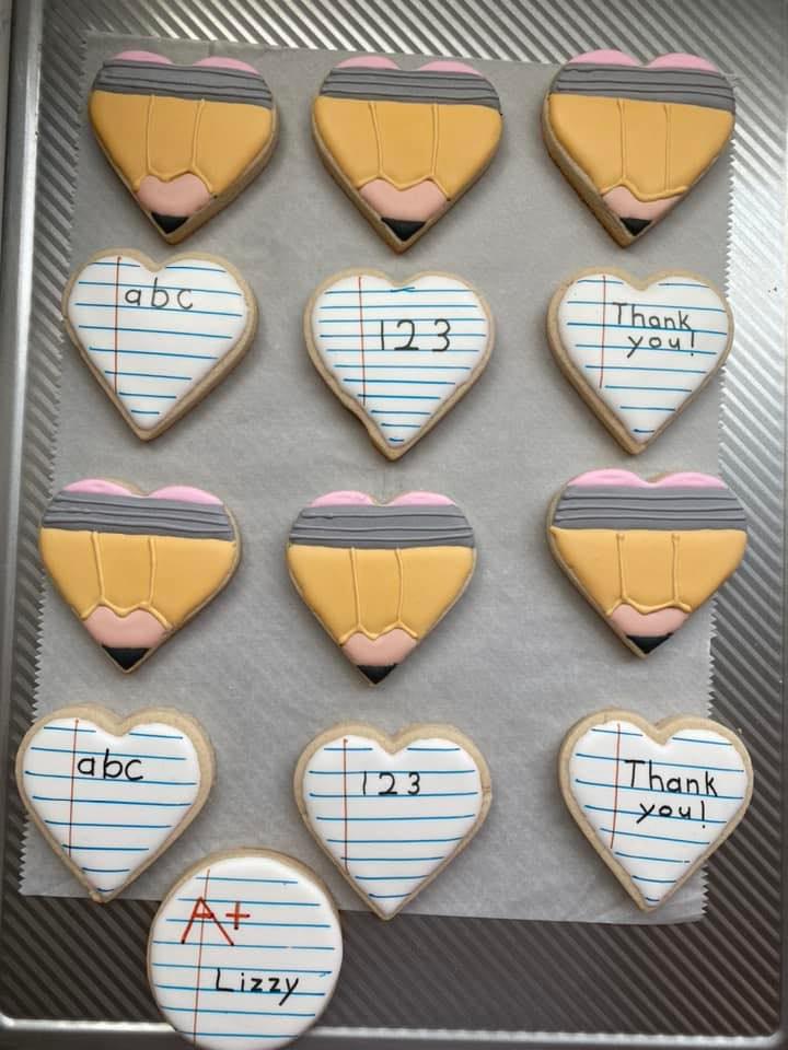 Back-to-school themed decorated sugar cookies with pencils and apple designs